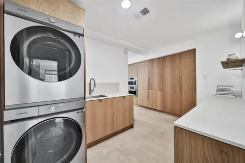a living room with two washing machine