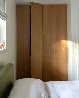 a bedroom with a bed and a couch