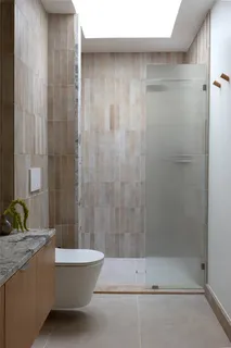 a bedroom with a bed and a chair