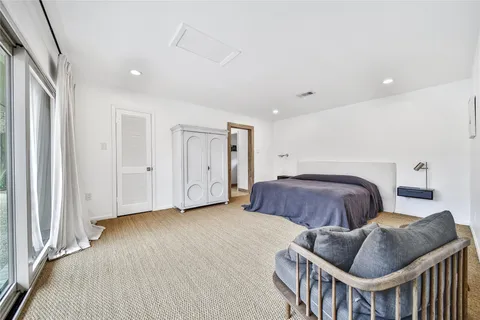 a room with a bed and a window