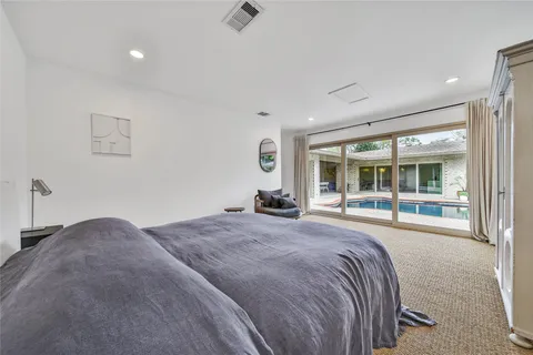 a bedroom with furniture and a window