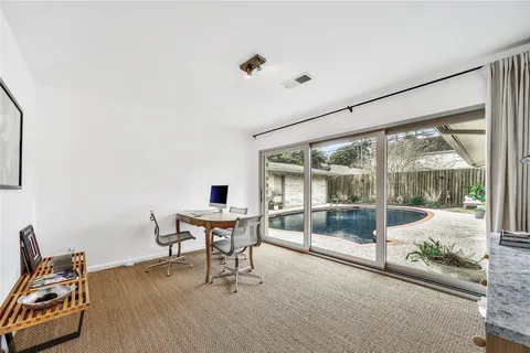 a bedroom with a bed and chair