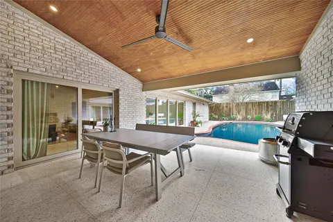 a work room with wooden floor and furniture