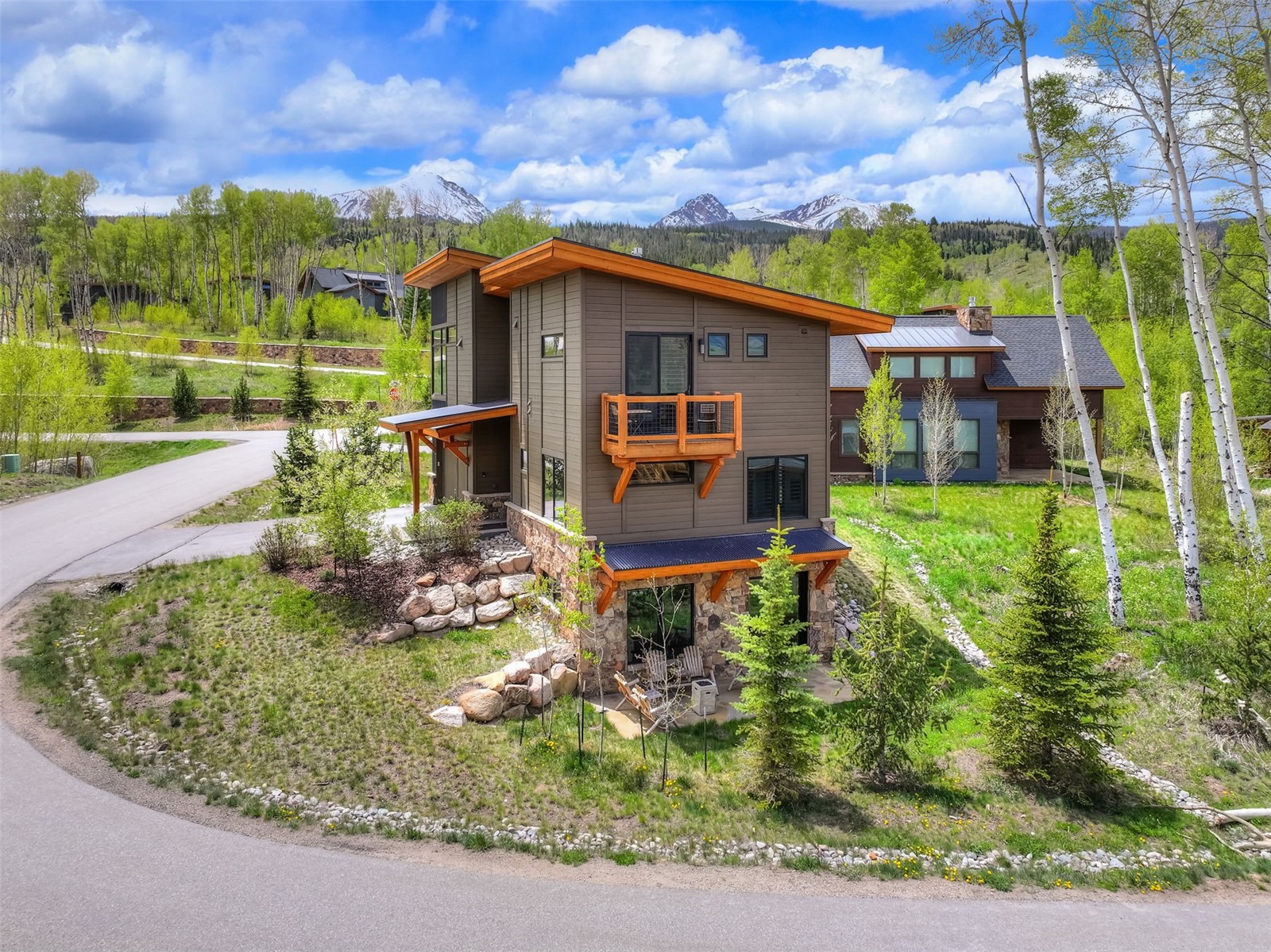 21 Moss Way Silverthorne, CO 80498 - Photo 37 of 50 a view of a house with a big yard potted plants and large tree