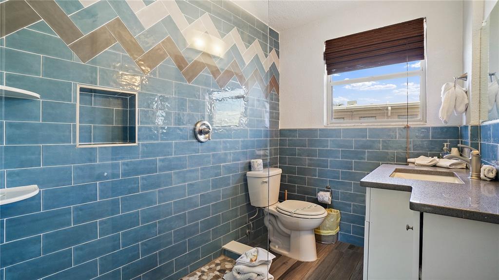 6700 Sunset Way, Unit 206 St. Pete Beach, FL 33706 - Photo 11 of 24 a bathroom with a toilet and a sink