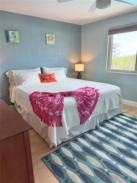 6700 Sunset Way, Unit 206 St. Pete Beach, FL 33706 - Photo 17 of 24 a bedroom with a bed and window