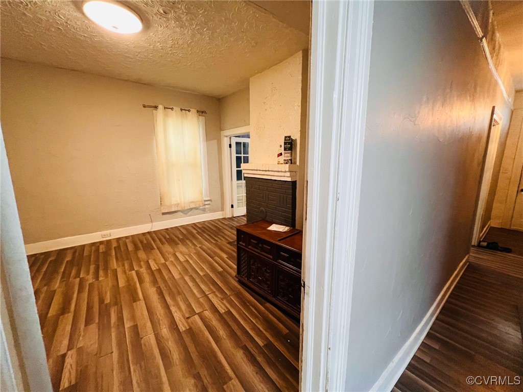 1703 Decatur Street Richmond, VA 23224 - Photo 3 of 24 Hallway with baseboards, a textured ceiling, and d