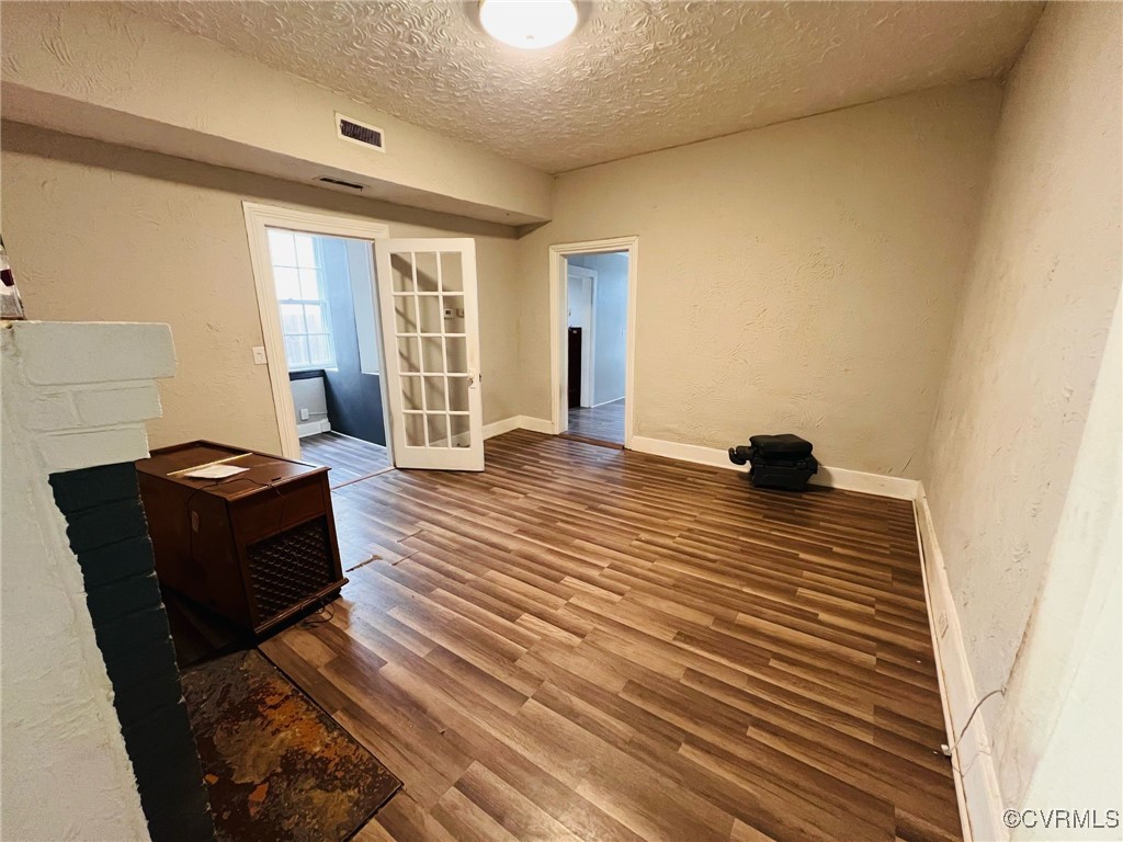 1703 Decatur Street Richmond, VA 23224 - Photo 4 of 24 Living room with visible vents, wood finished floo