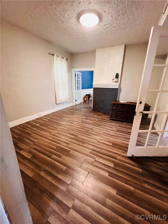 1703 Decatur Street Richmond, VA 23224 - Photo 5 of 24 Spare room featuring baseboards, wood finished flo