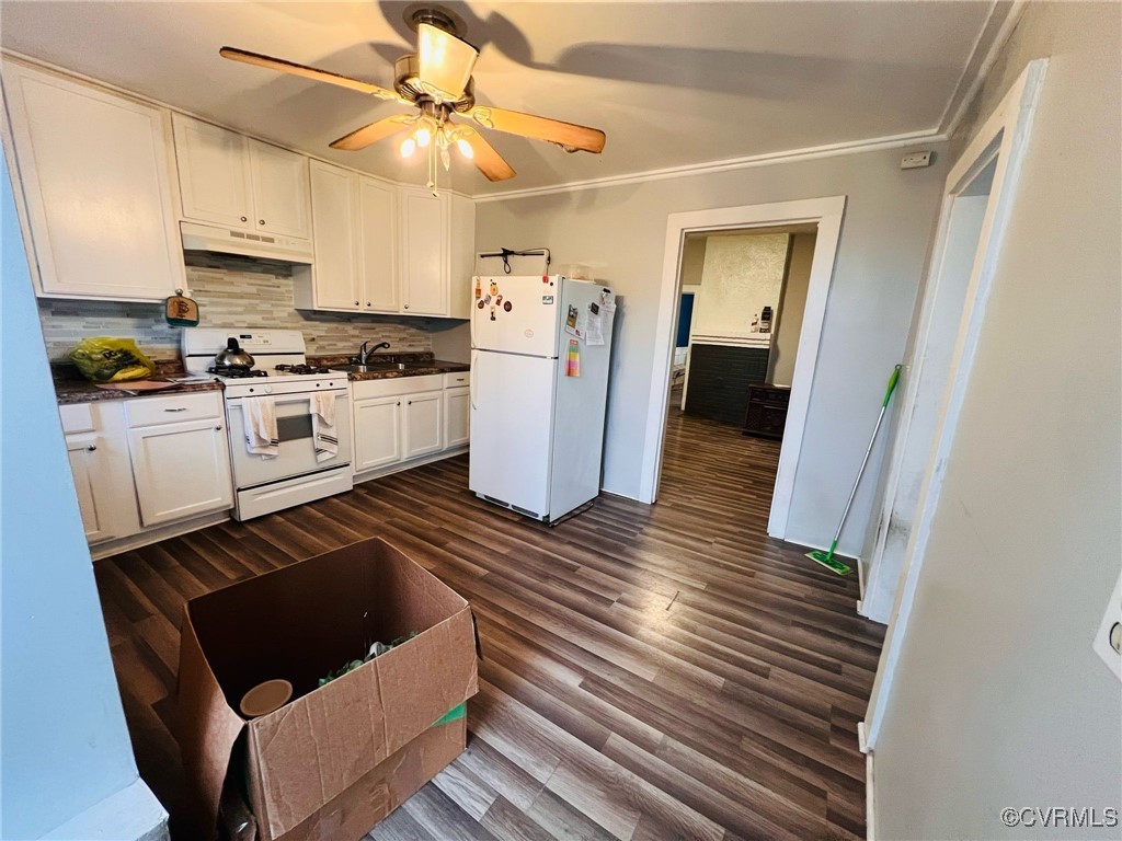 1703 Decatur Street Richmond, VA 23224 - Photo 7 of 24 Kitchen with white appliances, dark wood-style flo