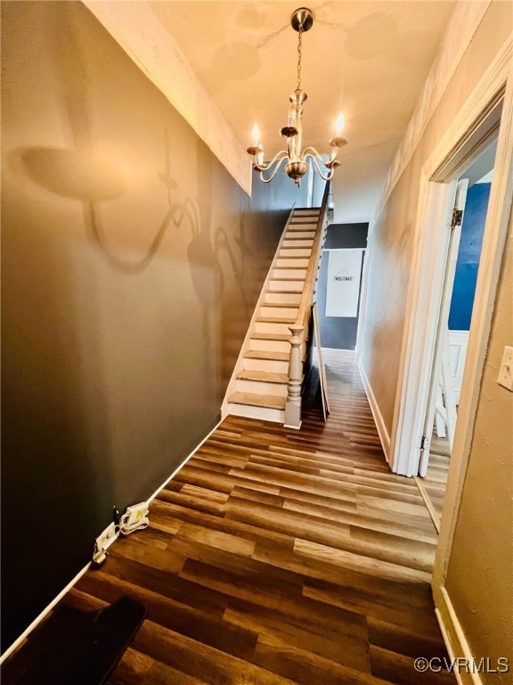 1703 Decatur Street Richmond, VA 23224 - Photo 10 of 24 Stairs with an inviting chandelier, baseboards, an
