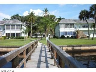 3225 East Riverside Drive Fort Myers, FL 33916 - Photo 2 of 4 a view of a house with a yard