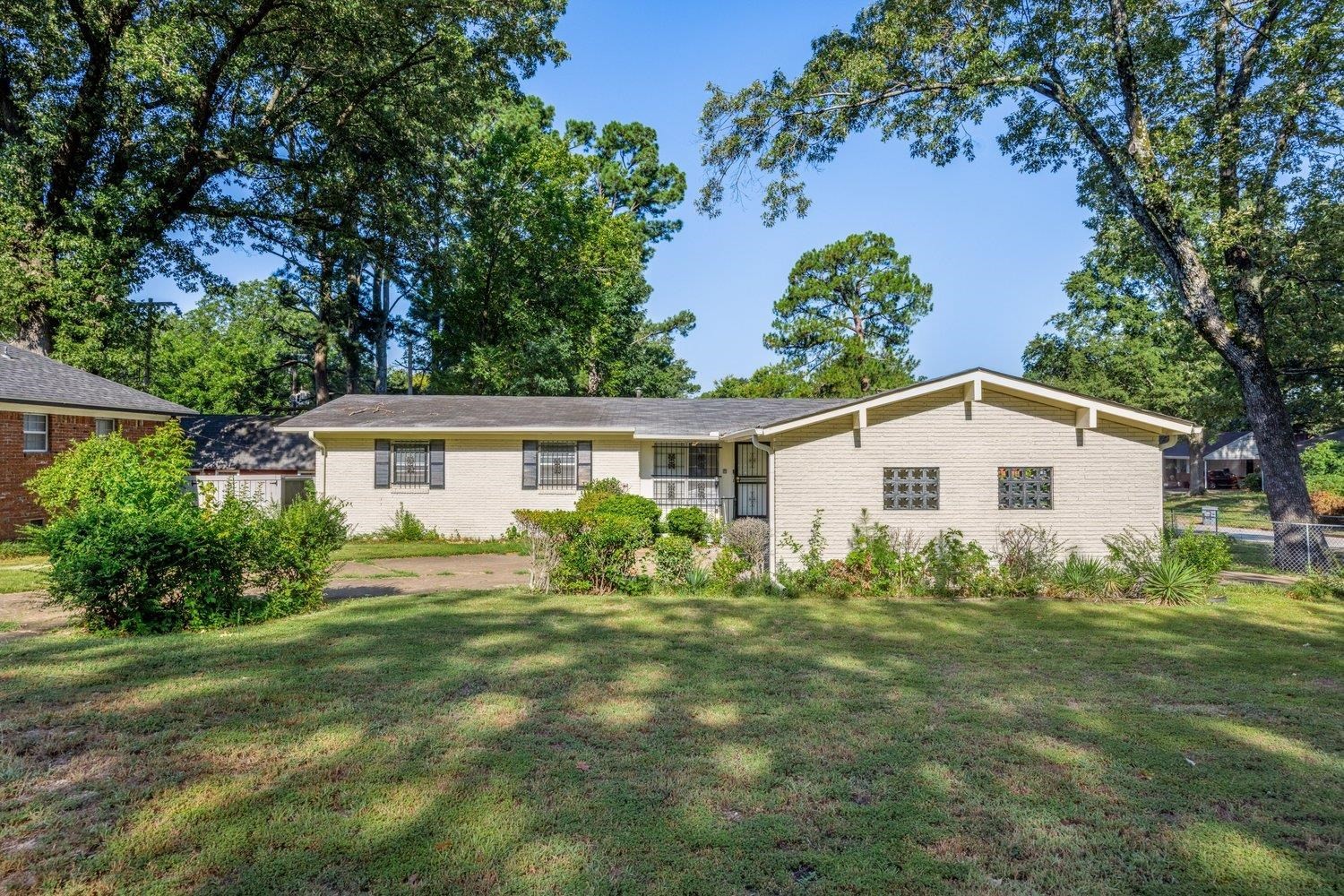 4025 Bishops Bridge Road Memphis, TN 38118 - Photo 1 of 18 a view of a house with a yard