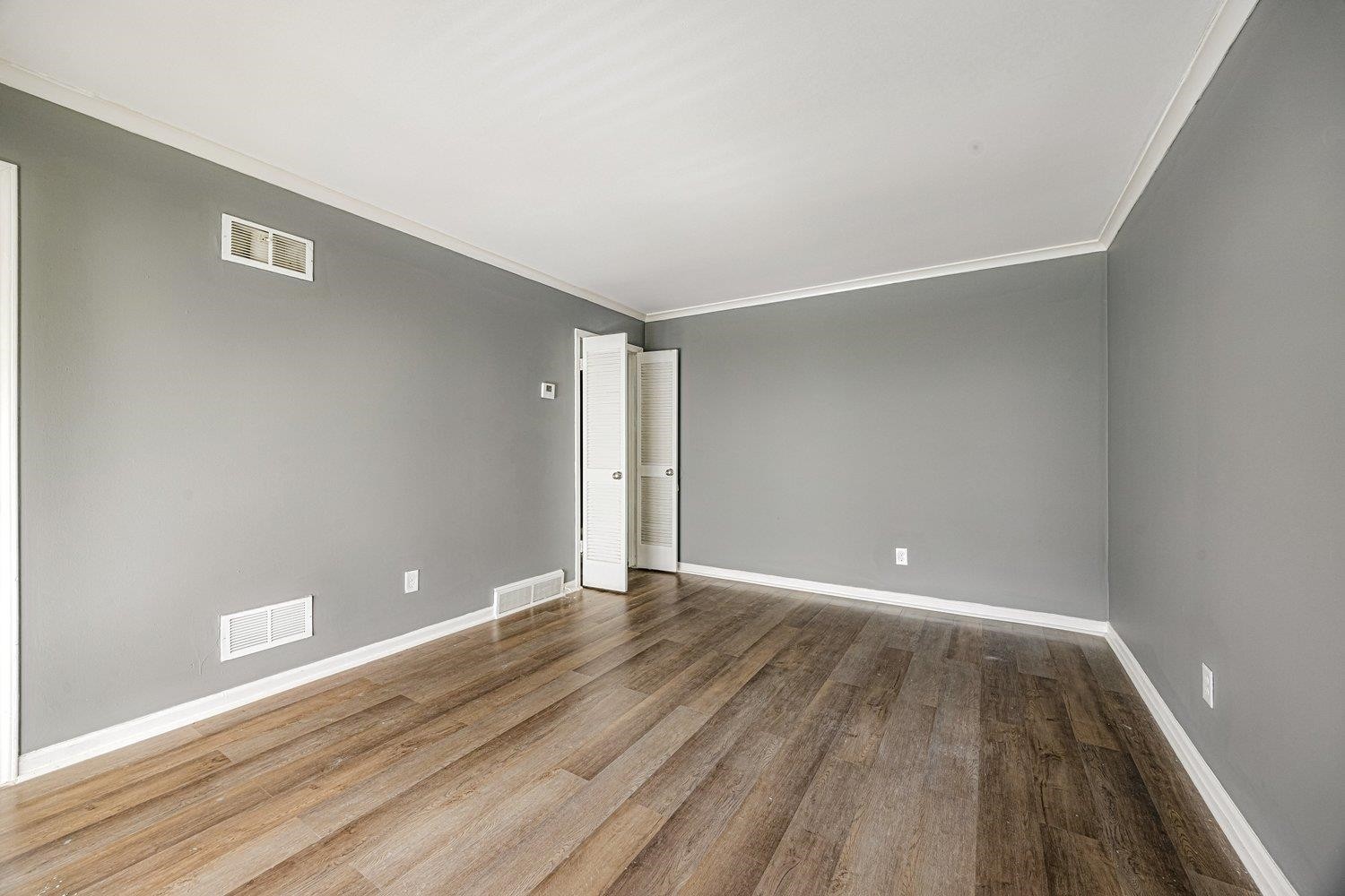 4025 Bishops Bridge Road Memphis, TN 38118 - Photo 4 of 18 a view of an empty room with wooden floor