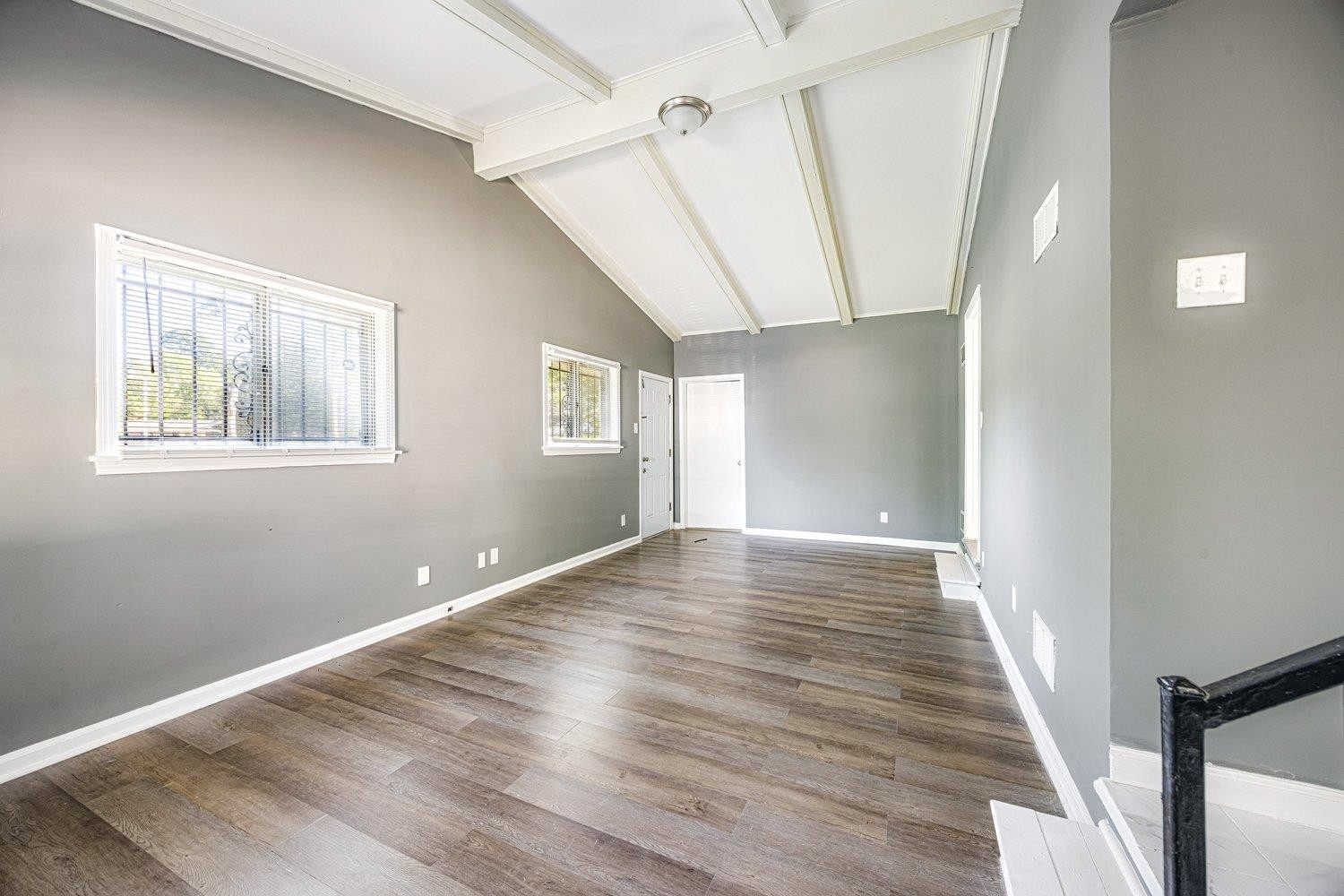 4025 Bishops Bridge Road Memphis, TN 38118 - Photo 6 of 18 a view of an empty room with wooden floor and a window