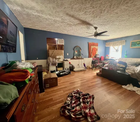 a bedroom with furniture and a window