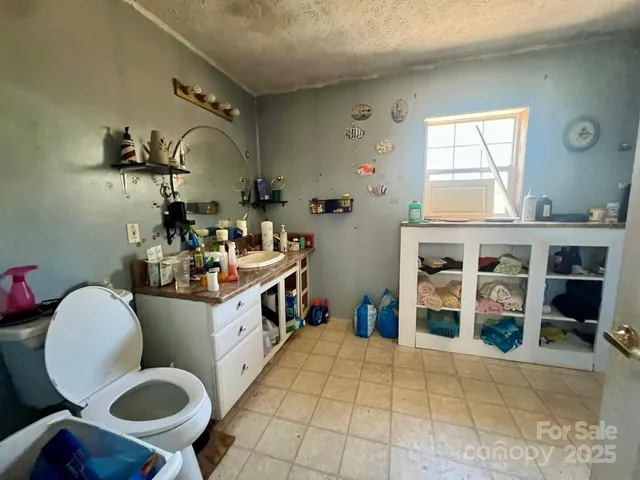 a kitchen with a sink cabinets and appliances