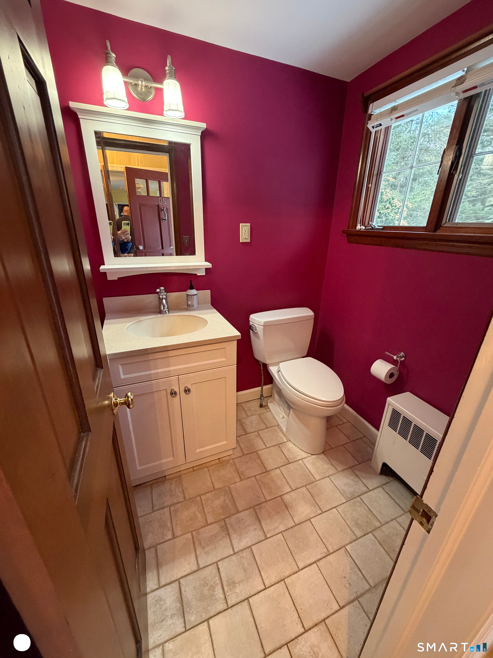 20 Arrowhead Road Wilton, CT 06897 - Photo 16 of 28 a bathroom with a toilet a sink and a mirror