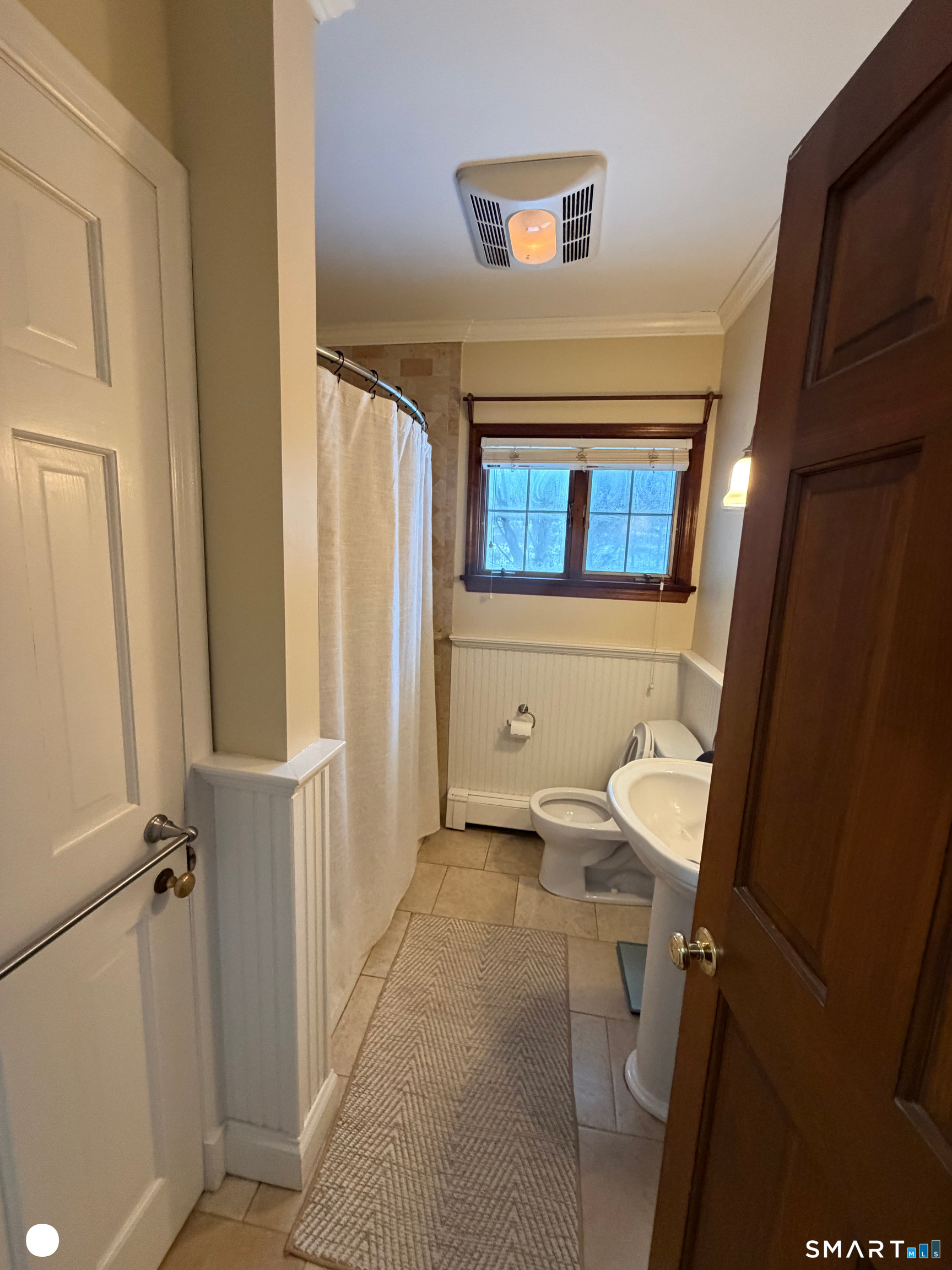 20 Arrowhead Road Wilton, CT 06897 - Photo 17 of 28 a bathroom with a sink a toilet and a mirror