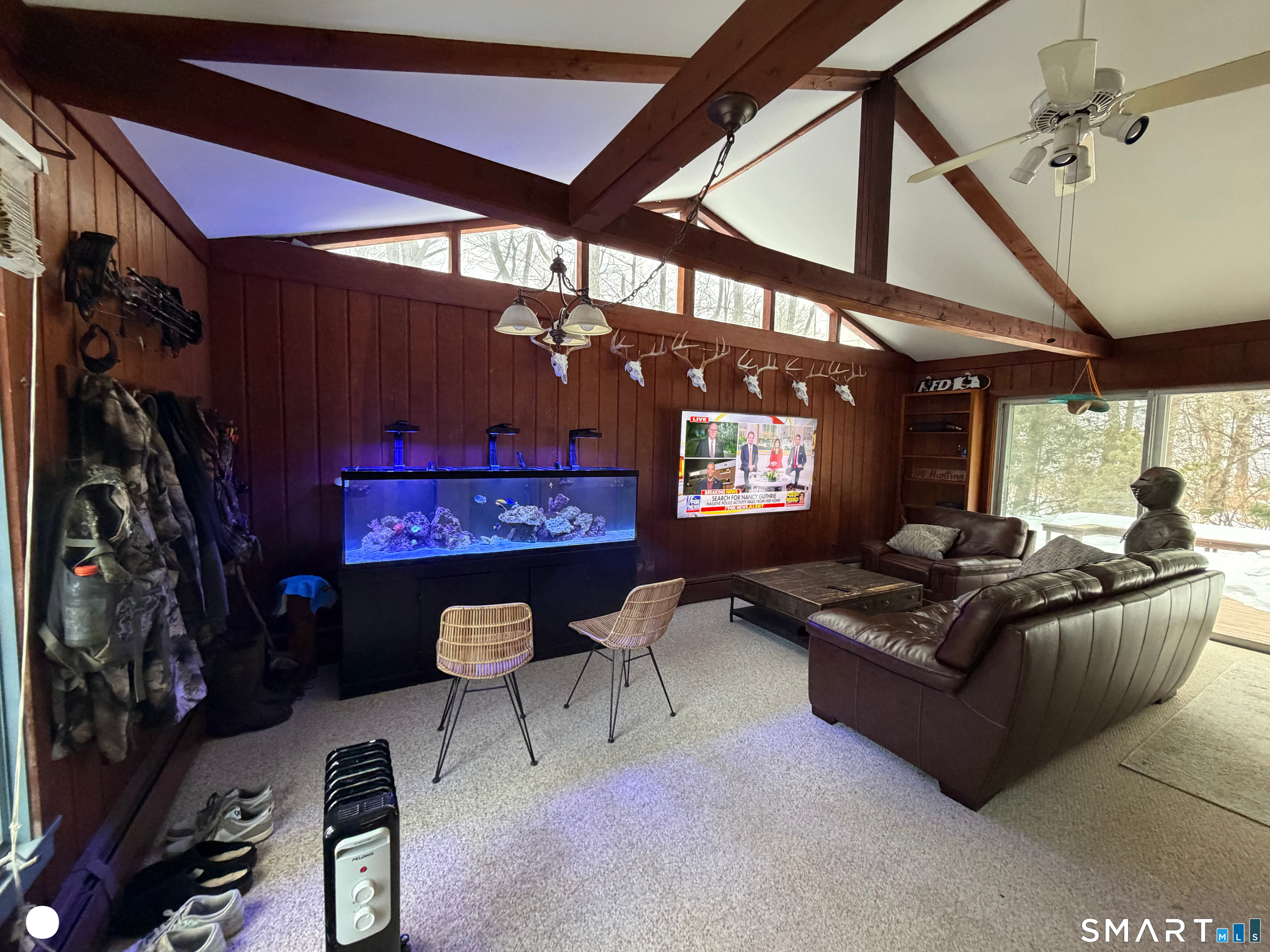 20 Arrowhead Road Wilton, CT 06897 - Photo 22 of 28 a living room with furniture a rug and a window