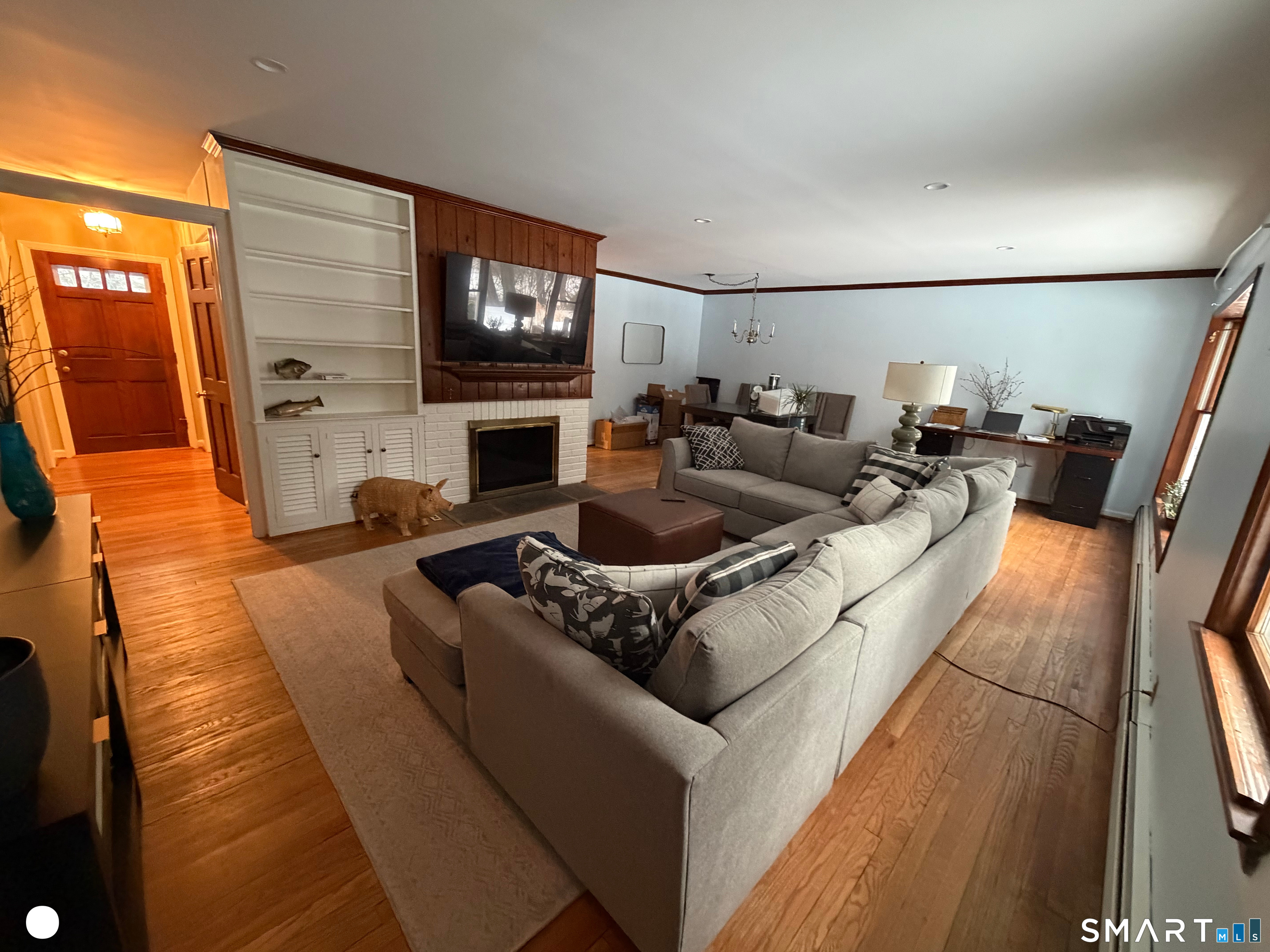 20 Arrowhead Road Wilton, CT 06897 - Photo 10 of 28 a living room with furniture and a flat screen tv