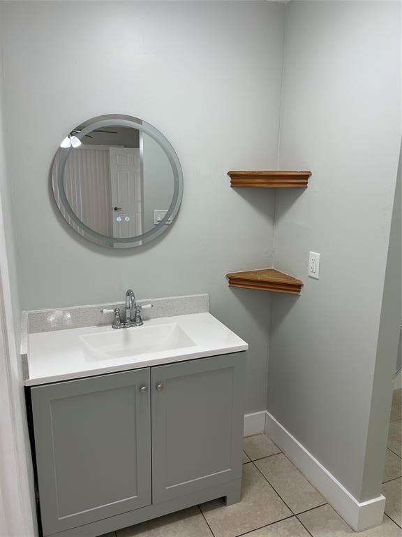 500 Northeast 34th Street Pompano Beach, FL 33064 - Photo 16 of 29 a bathroom with a sink and vanity