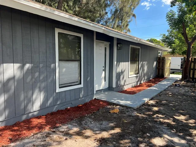 a view of a wooden door of the house