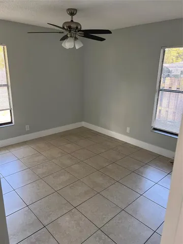 a view of a porch with wooden floor and stairs