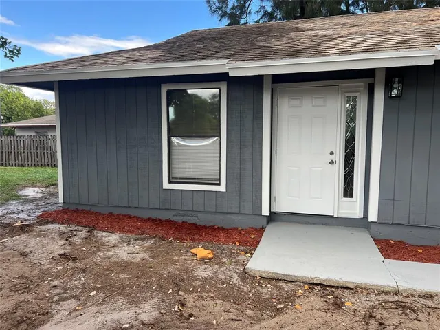 a view of backyard with green space