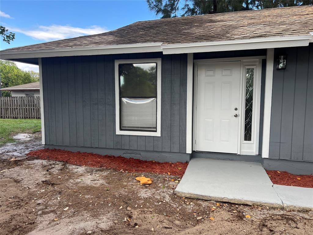 500 Northeast 34th Street Pompano Beach, FL 33064 - Photo 3 of 29 a view of a wooden door of the house
