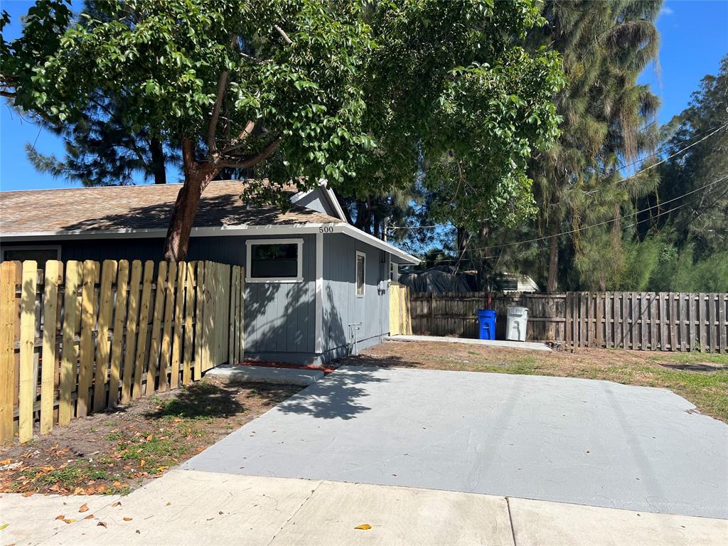 500 Northeast 34th Street Pompano Beach, FL 33064 - Photo 5 of 29 a front view of a house with a patio