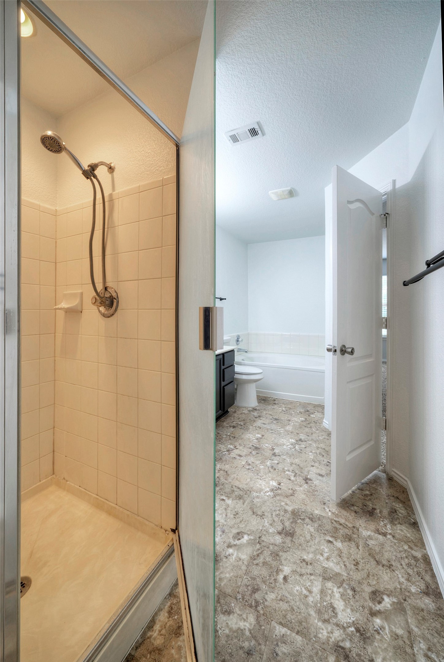 140 Plum Path Kyle, TX 78640 - Photo 10 of 22 a bathroom with a shower and a toilet