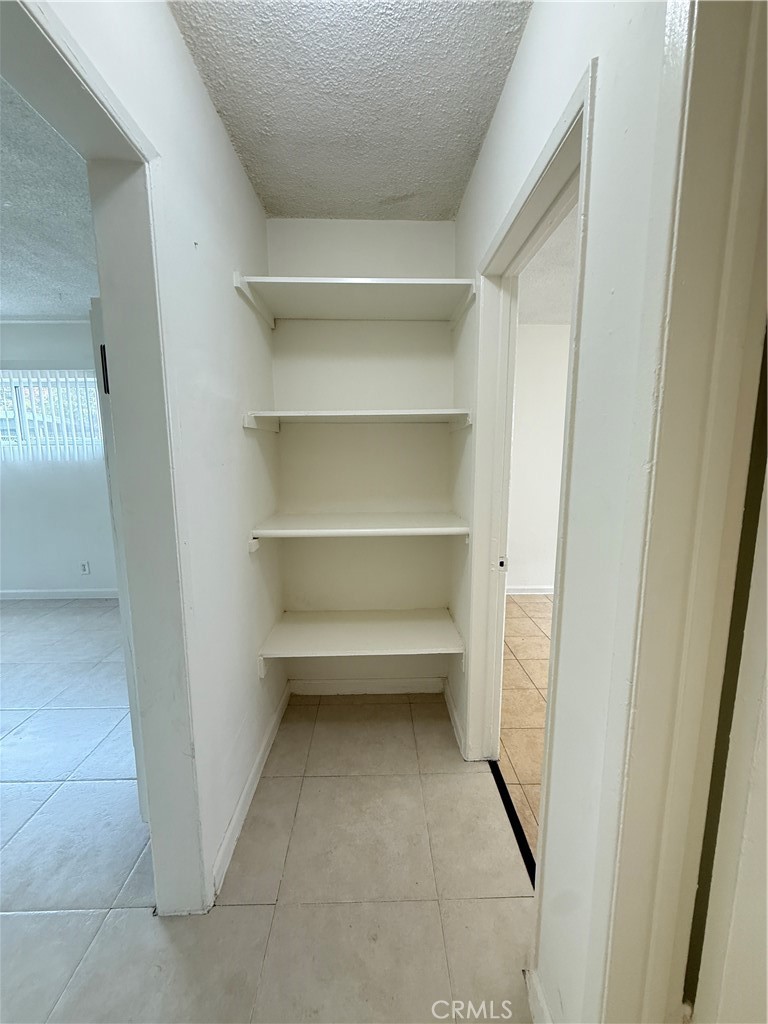 1168 North Mayfair Avenue, Unit 3 Anaheim, CA 92801 - Photo 8 of 10 a storage room with washer and dryer