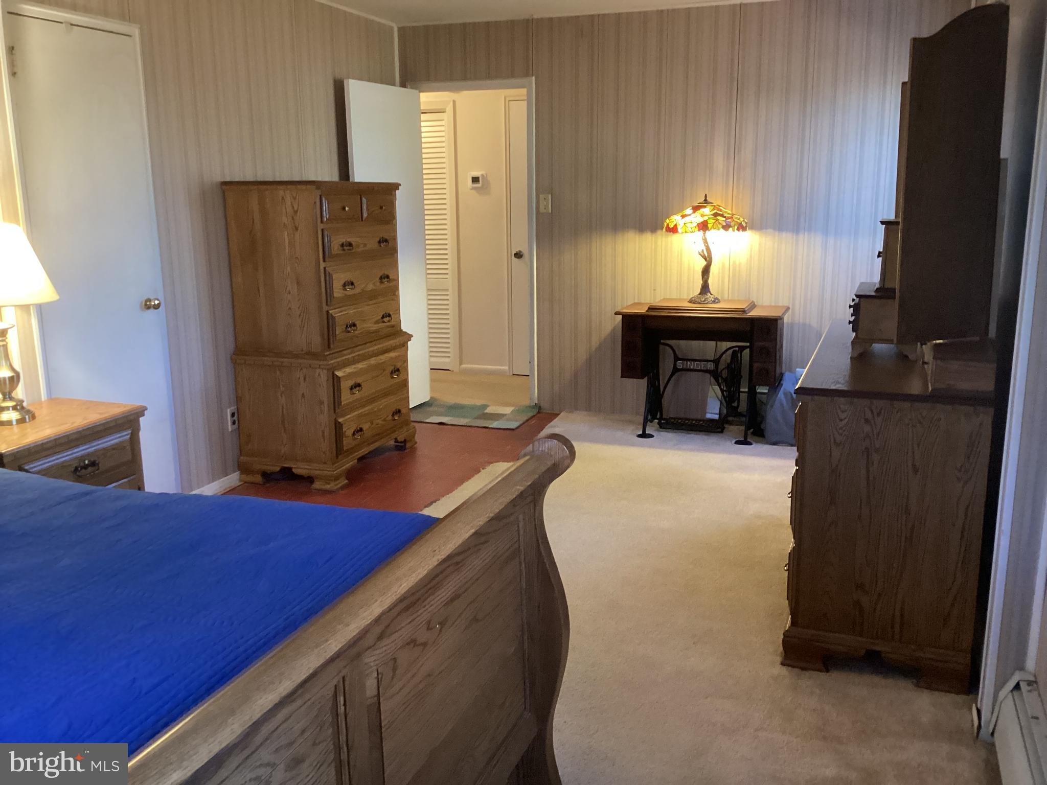 606 Fairhill Road Morrisville, PA 19067 - Photo 15 of 36 a bedroom with furniture and a fireplace
