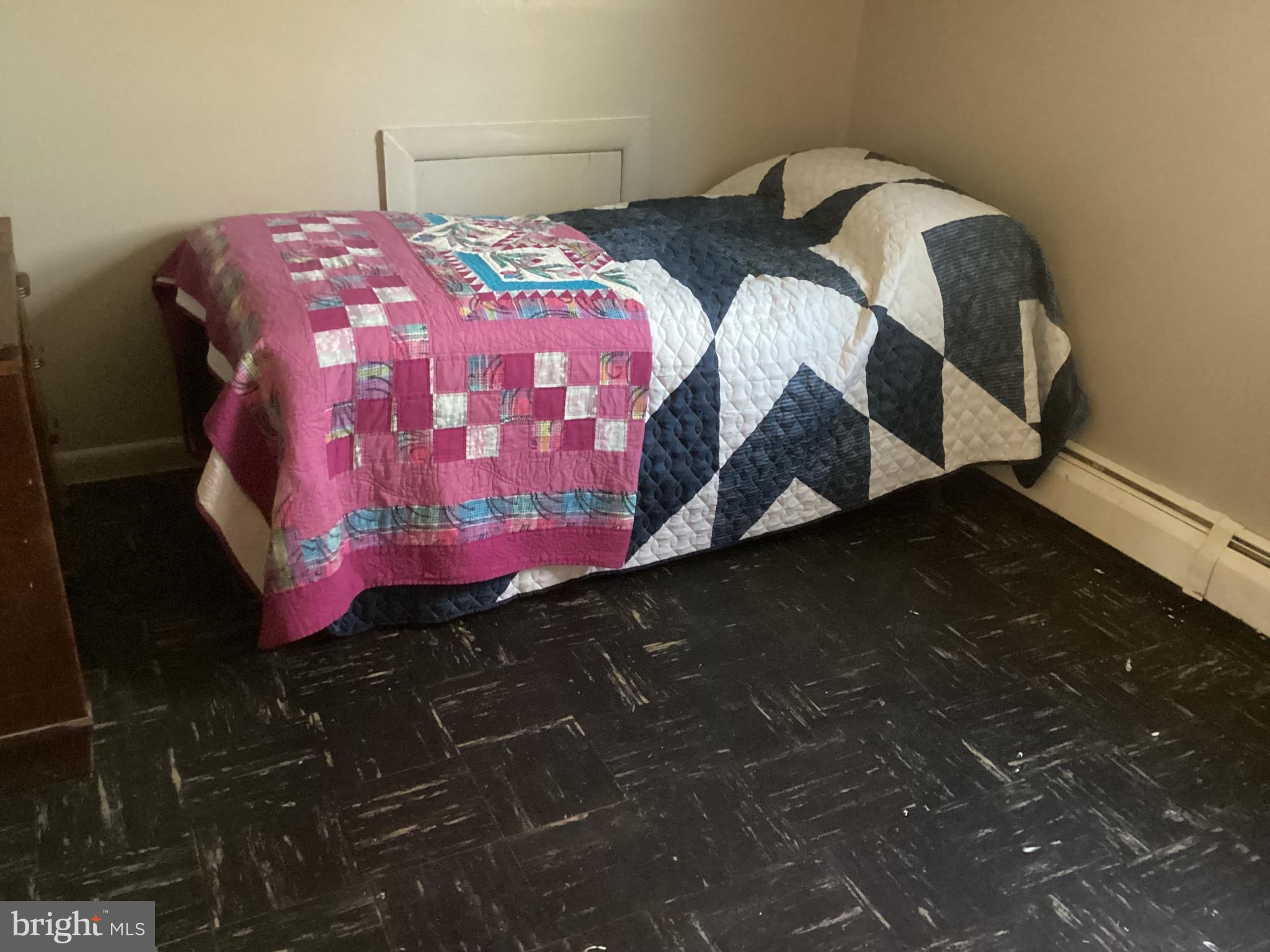 606 Fairhill Road Morrisville, PA 19067 - Photo 23 of 36 a bedroom with a bed and a mirror