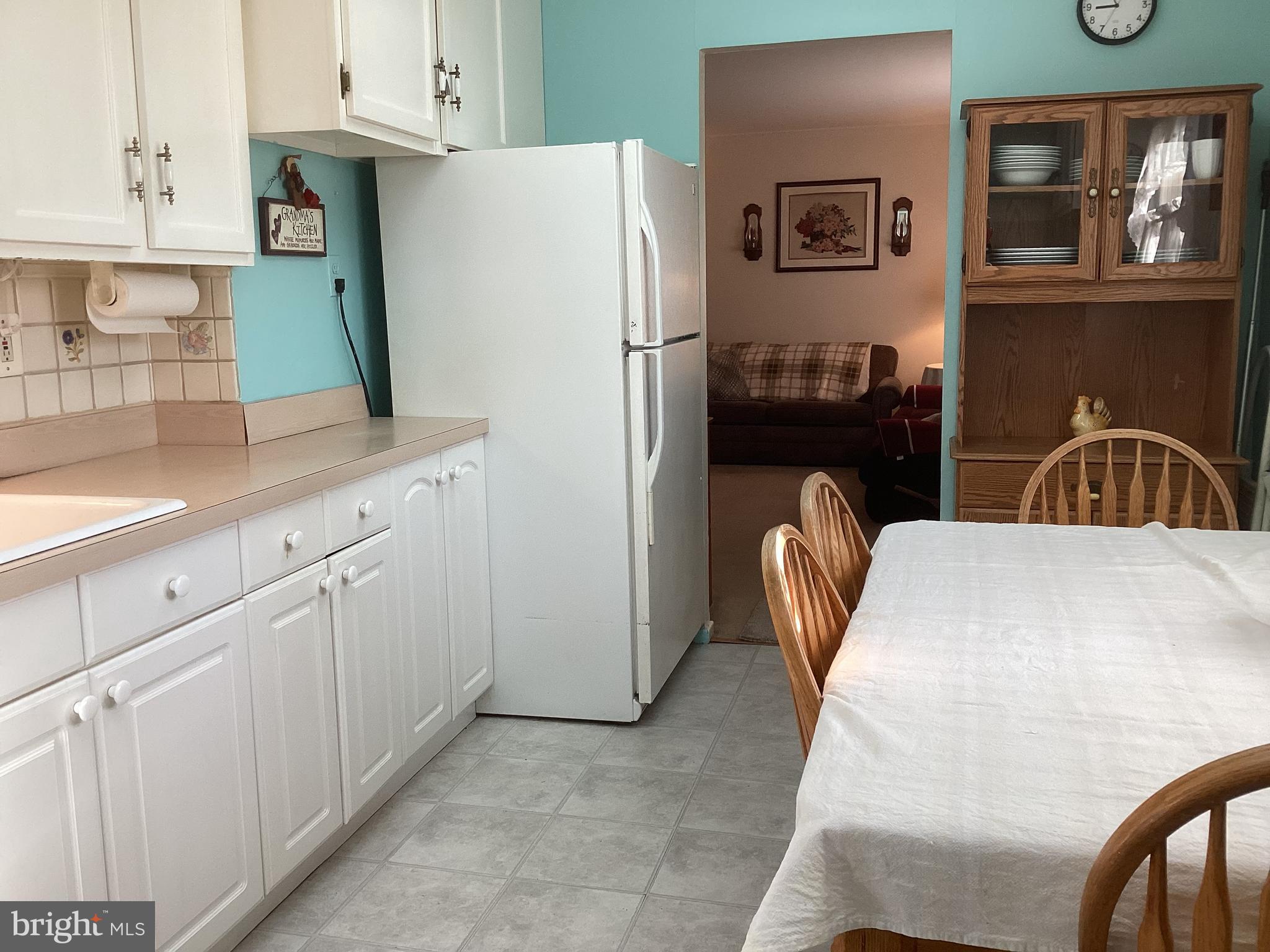606 Fairhill Road Morrisville, PA 19067 - Photo 3 of 36 a kitchen with stainless steel appliances granite countertop a refrigerator sink and white cabinets