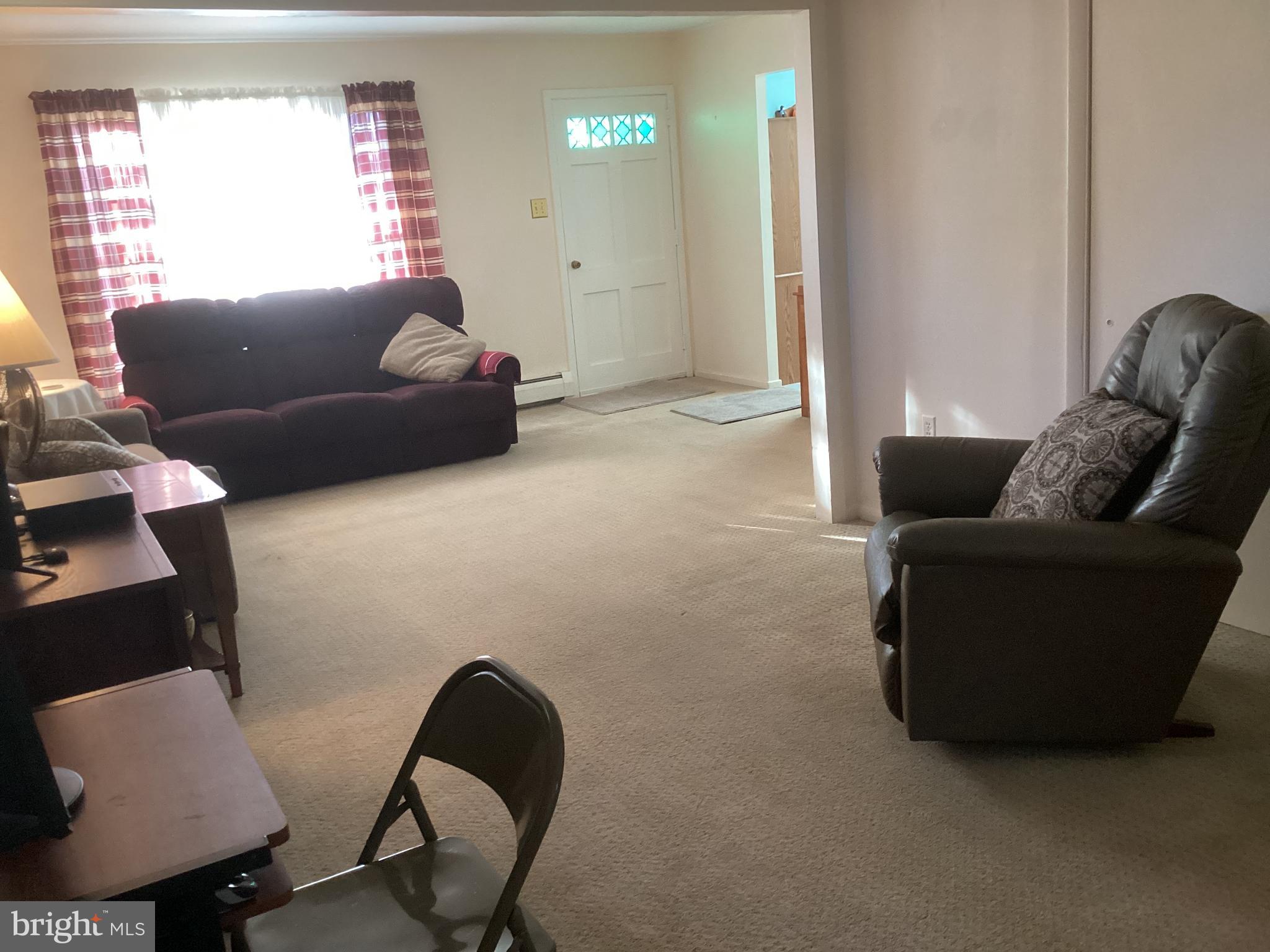 606 Fairhill Road Morrisville, PA 19067 - Photo 5 of 36 a living room with furniture and a couch