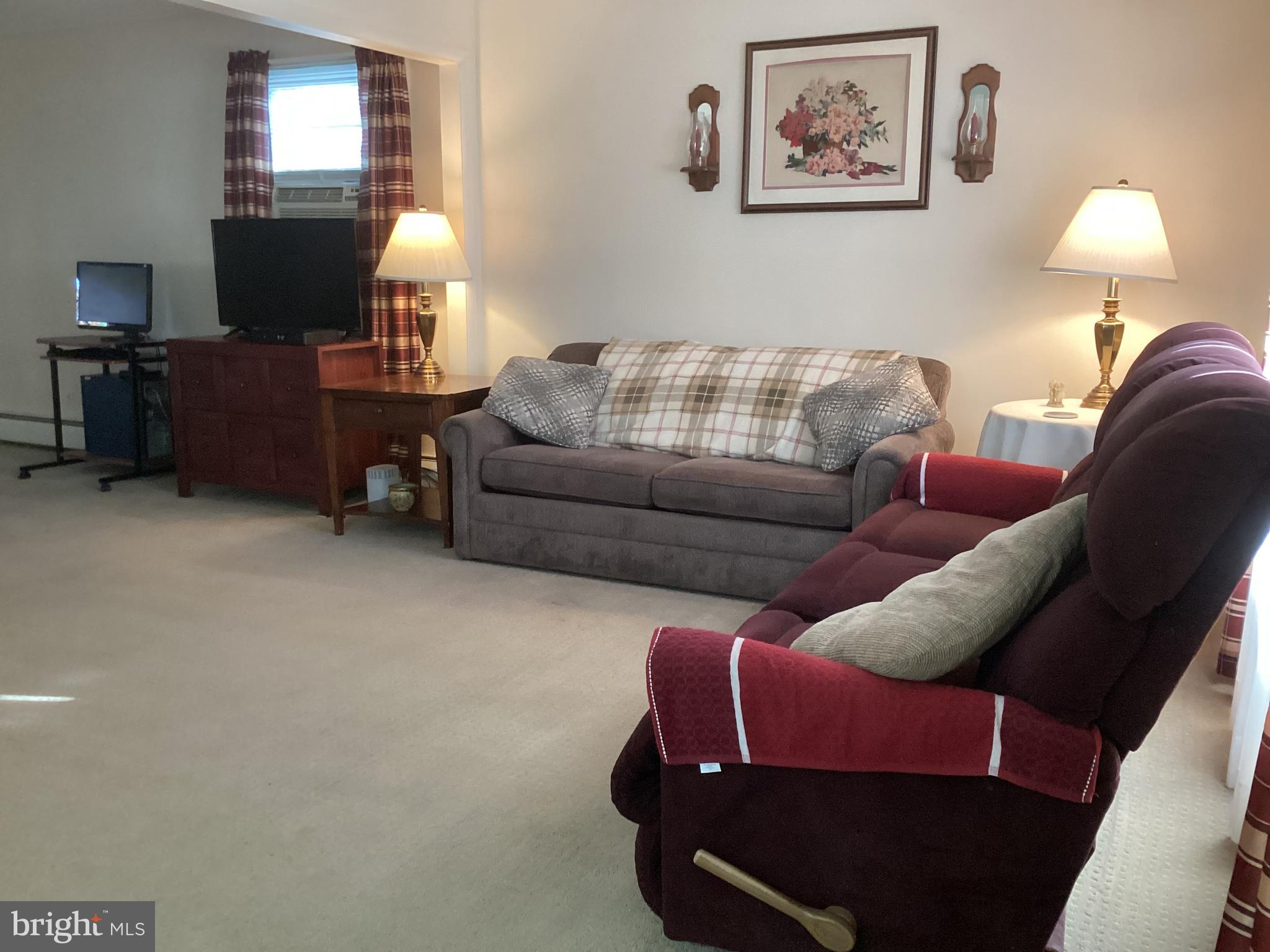 606 Fairhill Road Morrisville, PA 19067 - Photo 8 of 36 a living room with furniture and a lamp