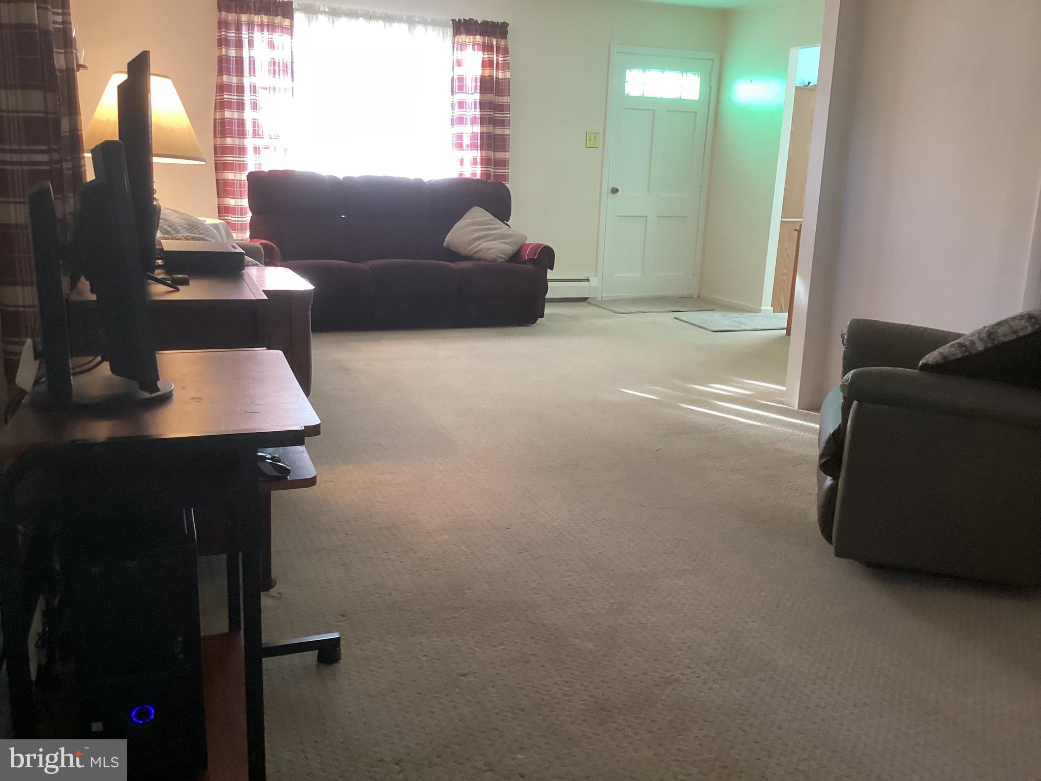 606 Fairhill Road Morrisville, PA 19067 - Photo 9 of 36 a living room with furniture and a lamp