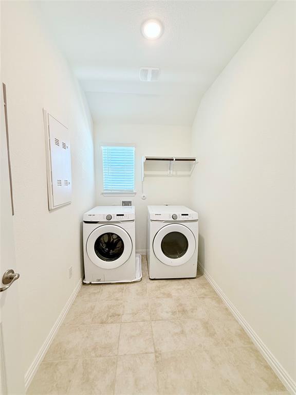 1336 Morning View Road Georgetown, TX 78628 - Photo 35 of 40 Functional laundry space featuring modern appliances and practical shelving.