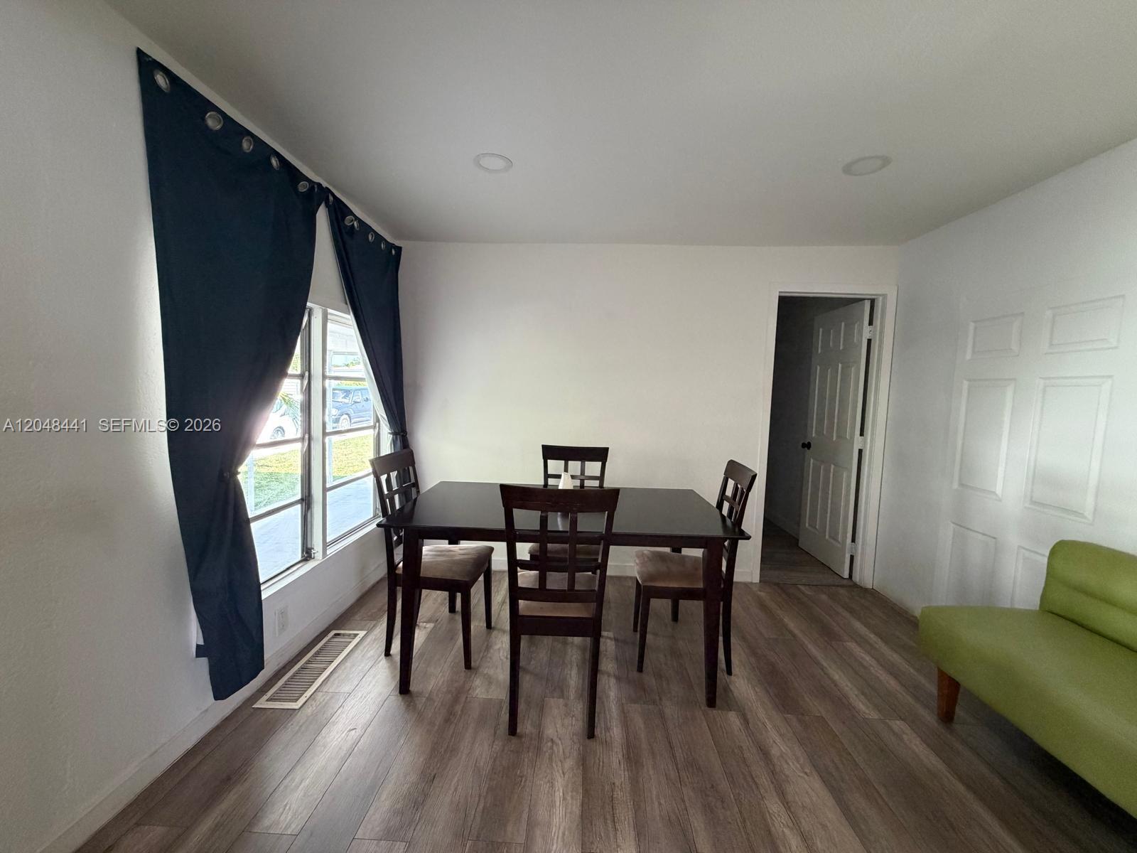 5331 Southwest 35th Street Davie, FL 33314 - Photo 9 of 31 a view of a dining room with furniture and window