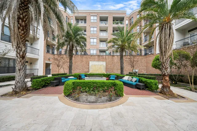 an aerial view of a house with garden space and street view
