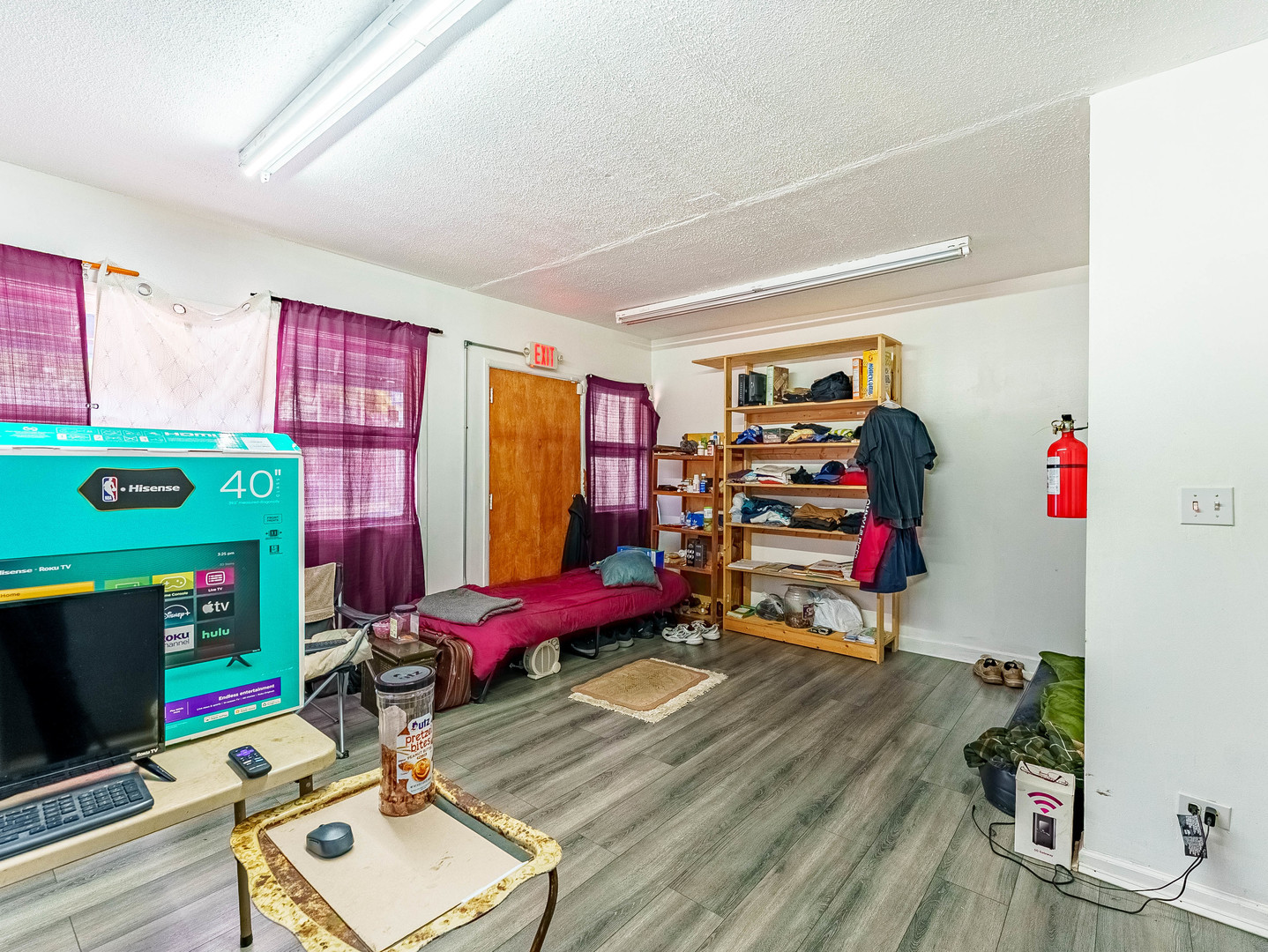 1014 Washington Street Waukegan, IL 60085 - Photo 2 of 18 a room with furniture a flat screen tv and a window