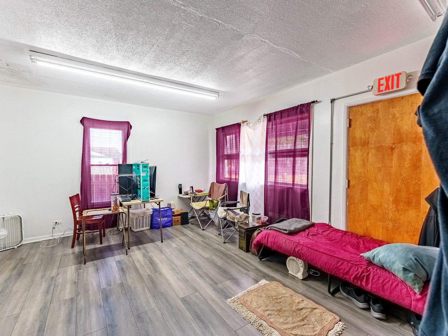 1014 Washington Street Waukegan, IL 60085 - Photo 3 of 18 a living room with furniture and a wooden floor
