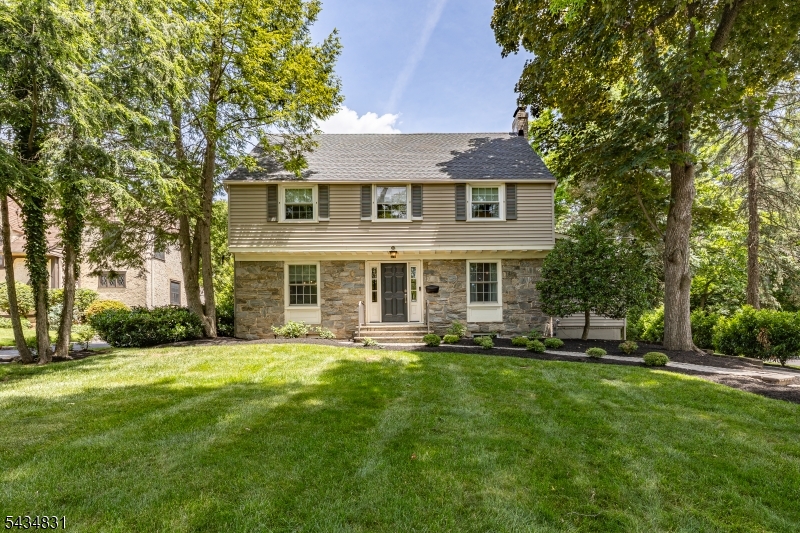 200 Wychwood Road Westfield, NJ 07090 - Photo 1 of 31 a front view of a house with a yard