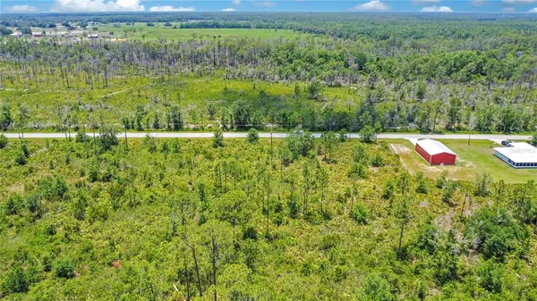 a view of a yard with an outdoor space