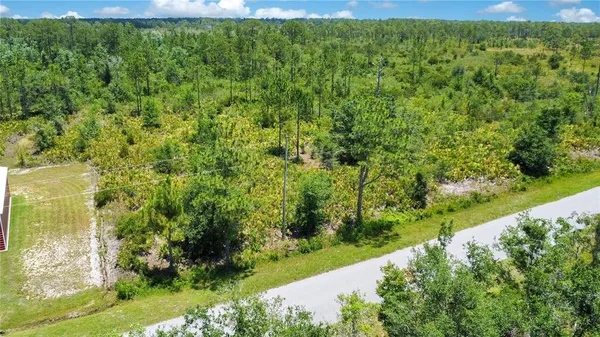 a view of a yard with an outdoor seating