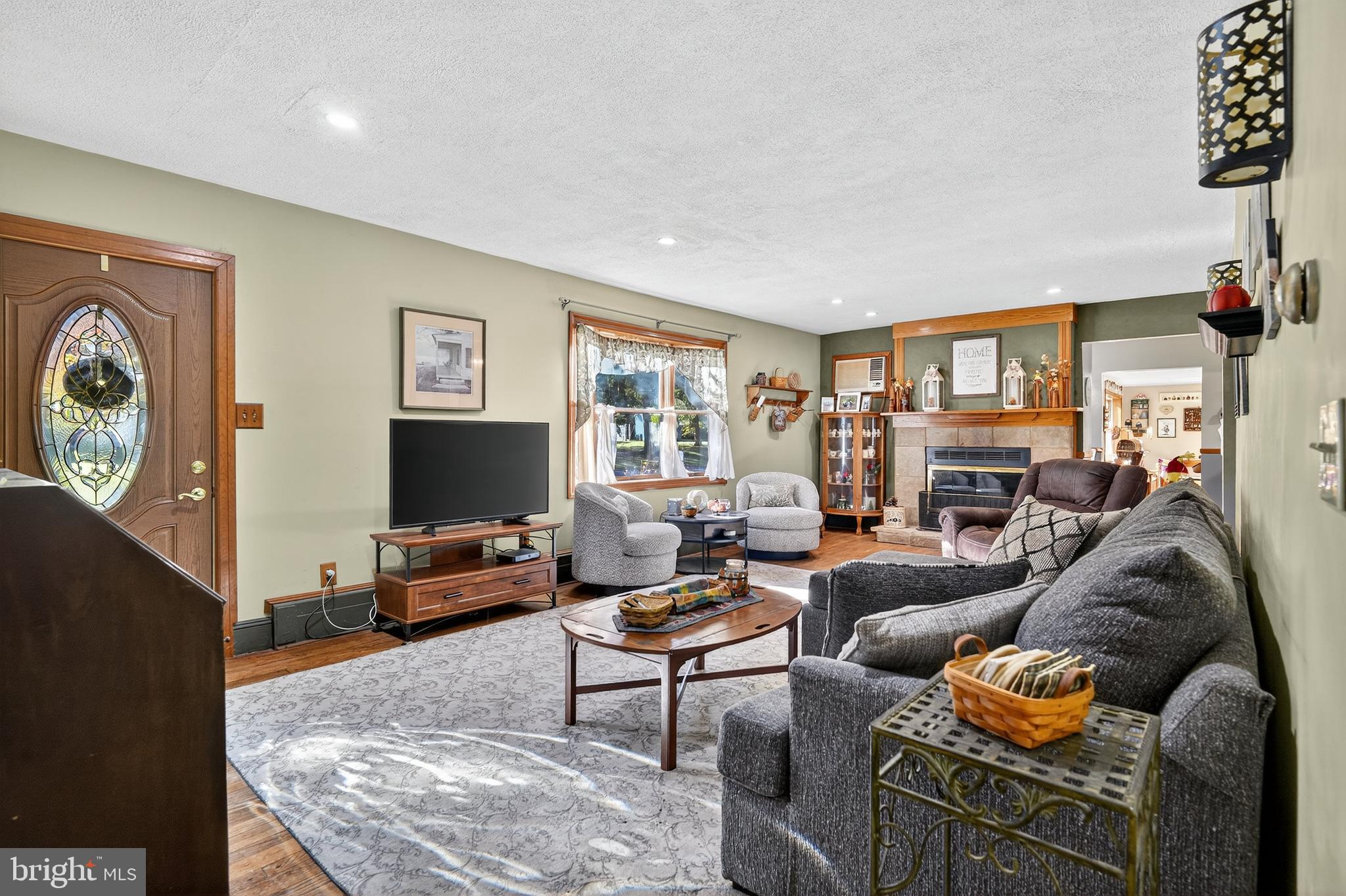 18 Monroe Drive Hamilton, NJ 08619 - Photo 2 of 37 a living room with furniture and a flat screen tv