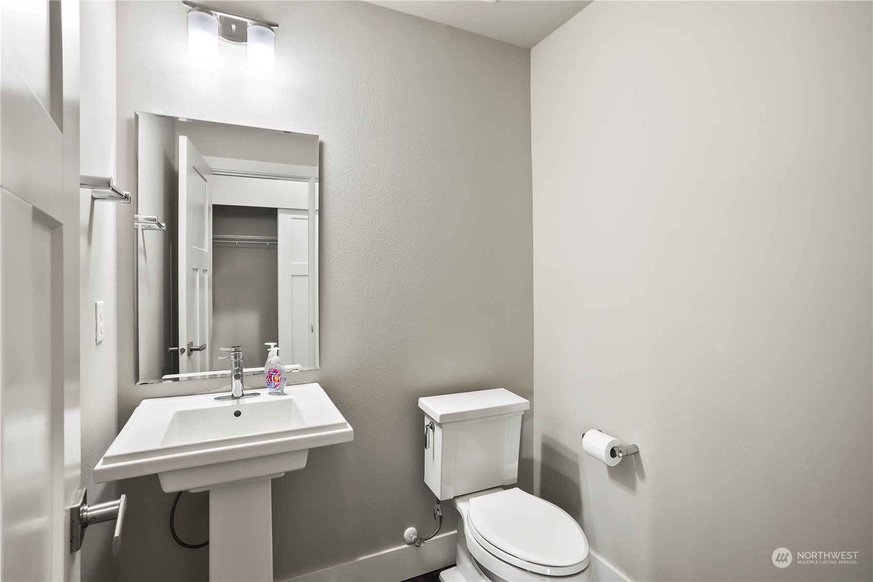 1224 198th Place Southeast Bothell, WA 98012 - Photo 13 of 38 a bathroom with a sink a toilet and mirror