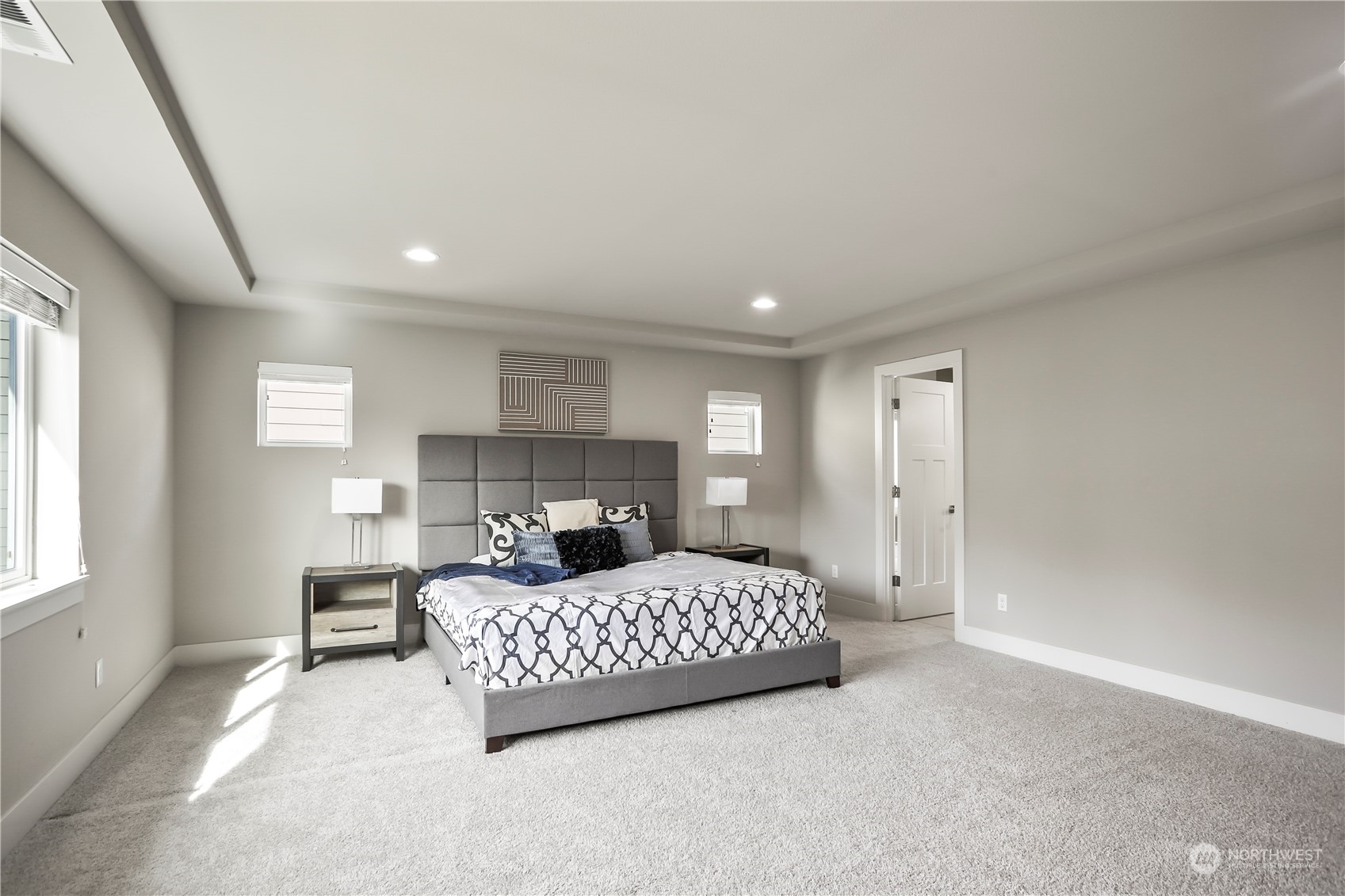 1224 198th Place Southeast Bothell, WA 98012 - Photo 16 of 38 a bedroom with a bed lamp and a window